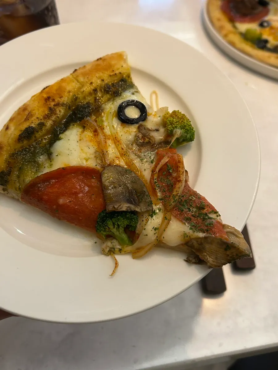 Generously plated pasta and pizza on display