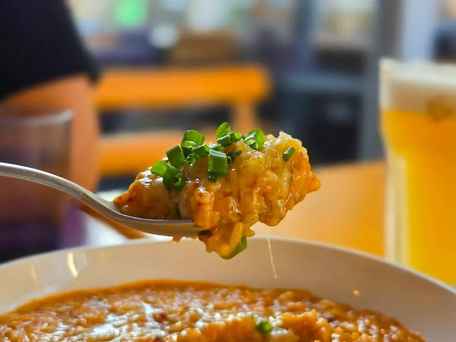 Close-up of kimchi risotto topped with cheese
