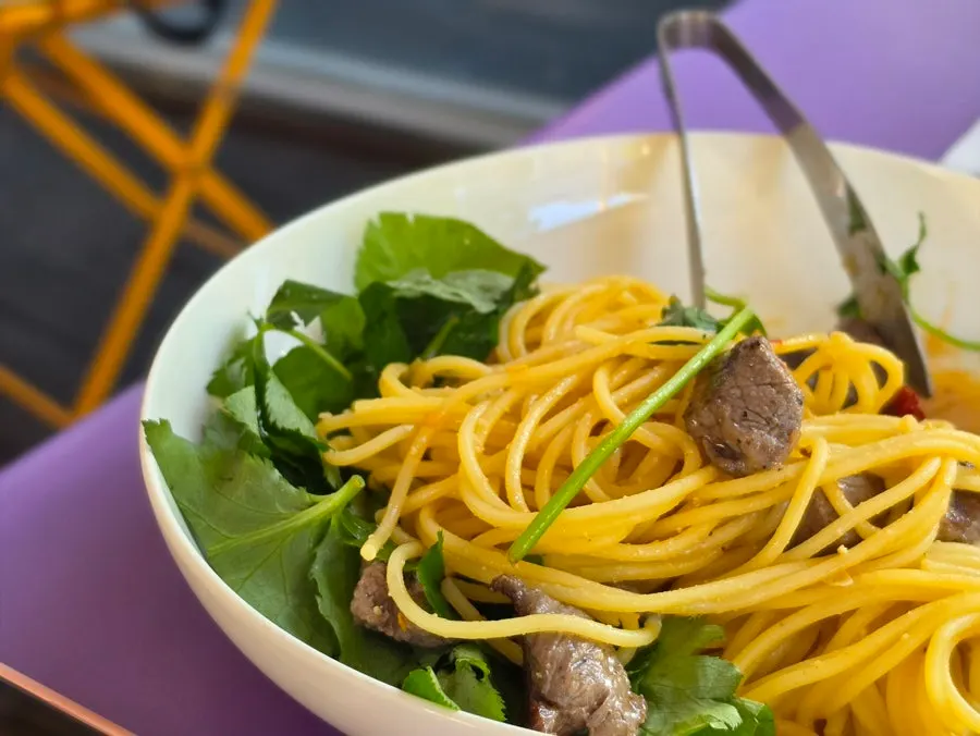 Close-up of doenjang cream pasta topped with chamnamul