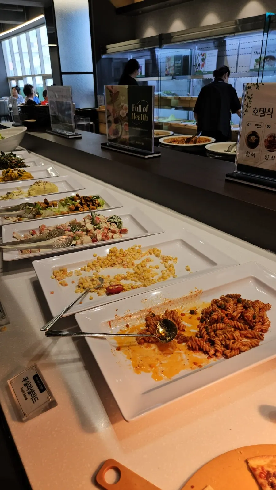 Hotel-style buffet station filled with Korean and Western dishes