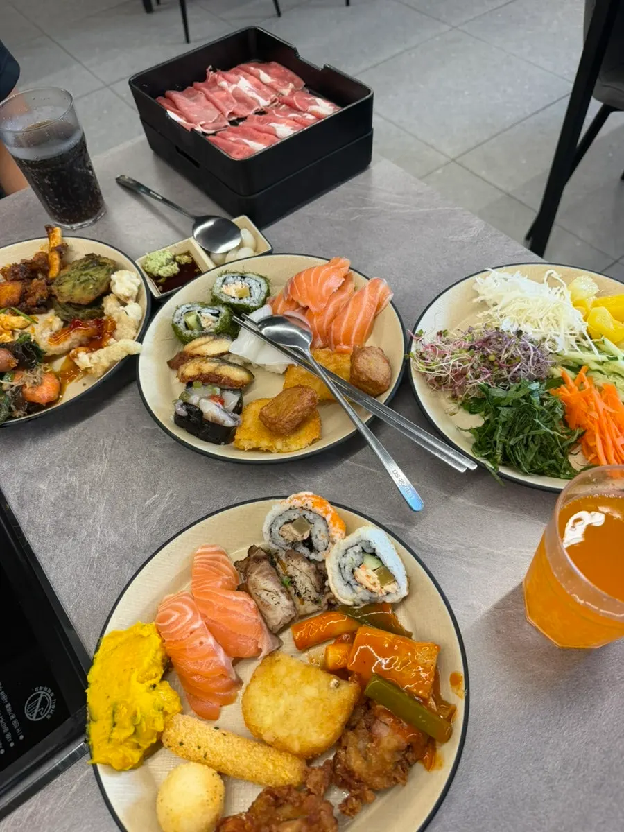 Vegetables added to a boiling shabu-shabu pot