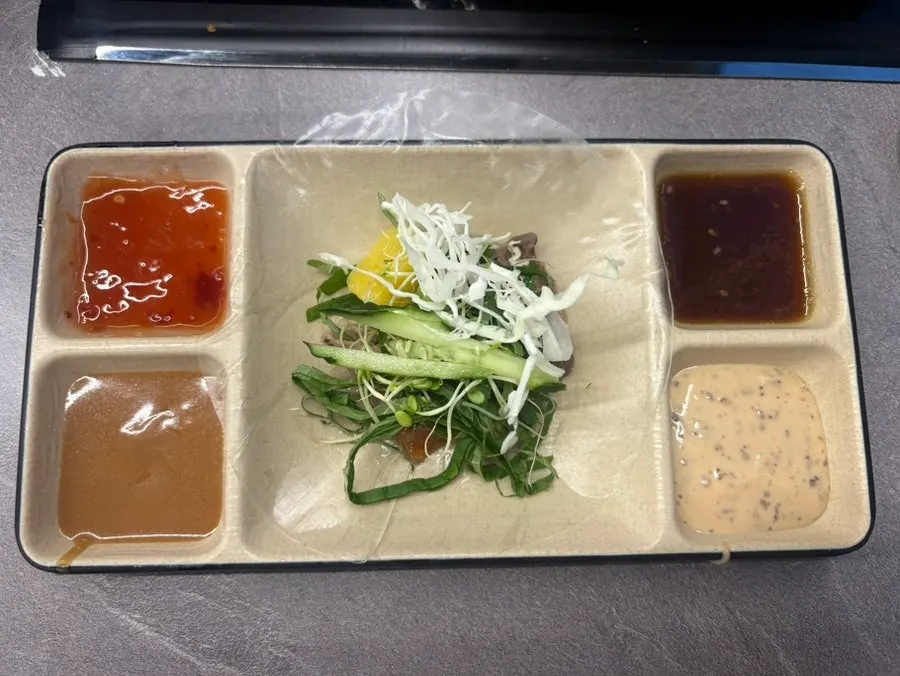 Homemade summer rolls and plated food