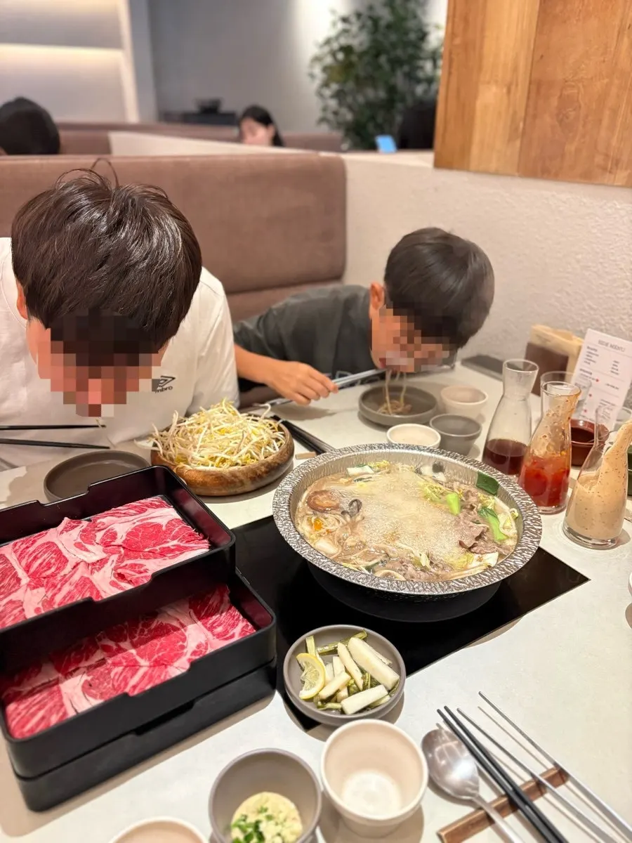 Small plate with bean sprouts and meat scooped together