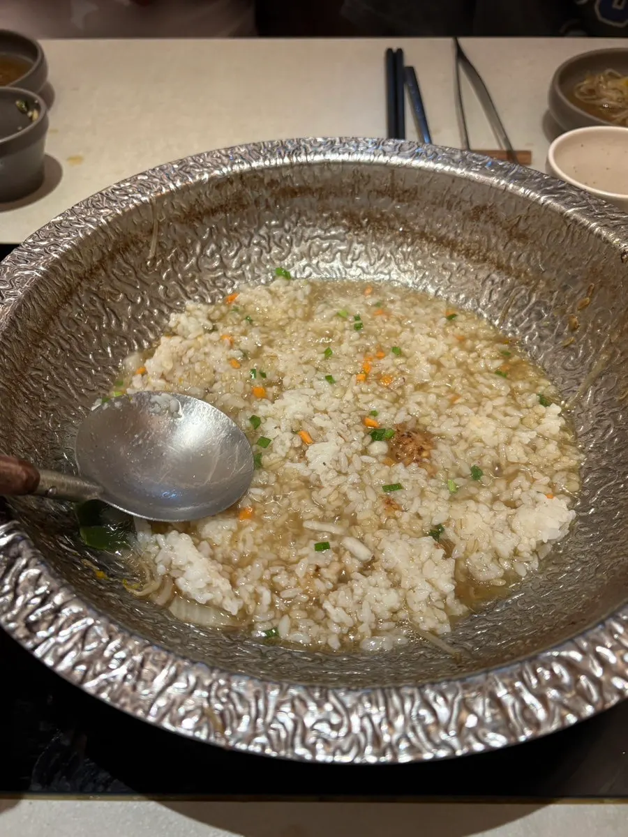 Pot of richly reduced broth just before the finishing course