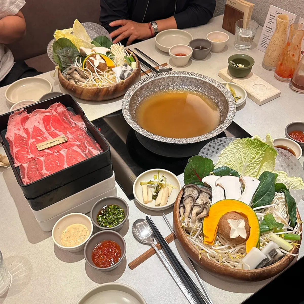 Representative photo of the shabu-shabu table setting at Shabu in Seoul Hapjeong Branch
