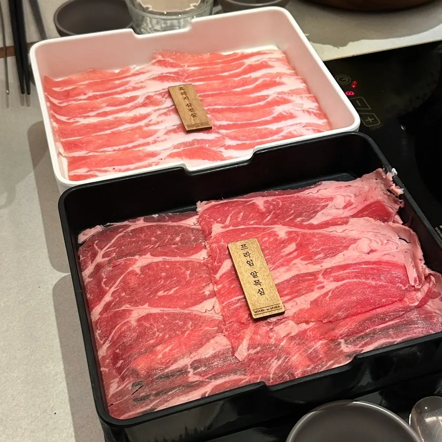 A piece of meat lifted out of the shabu-shabu pot