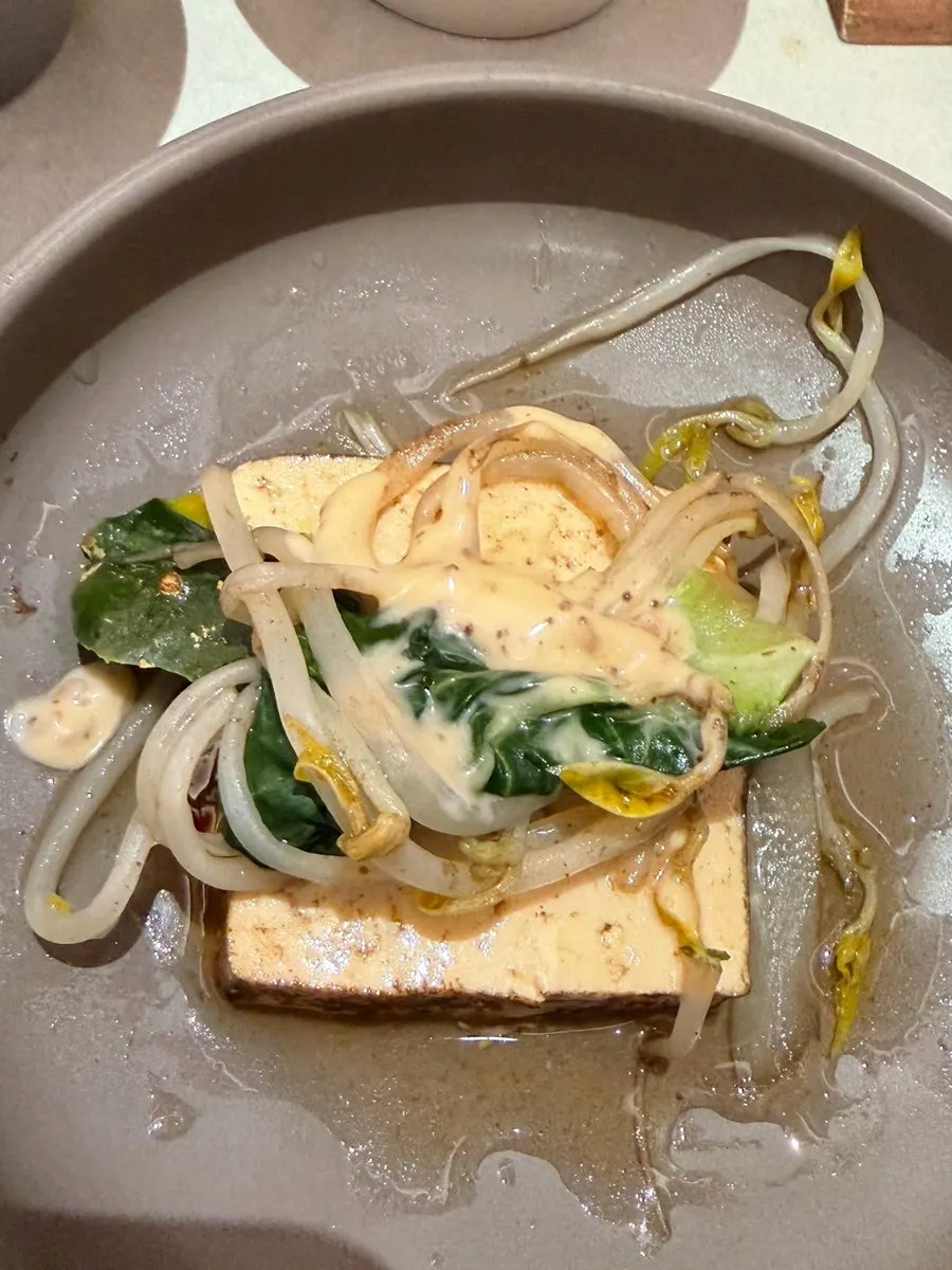 Sauce plate topped with garlic and scallion