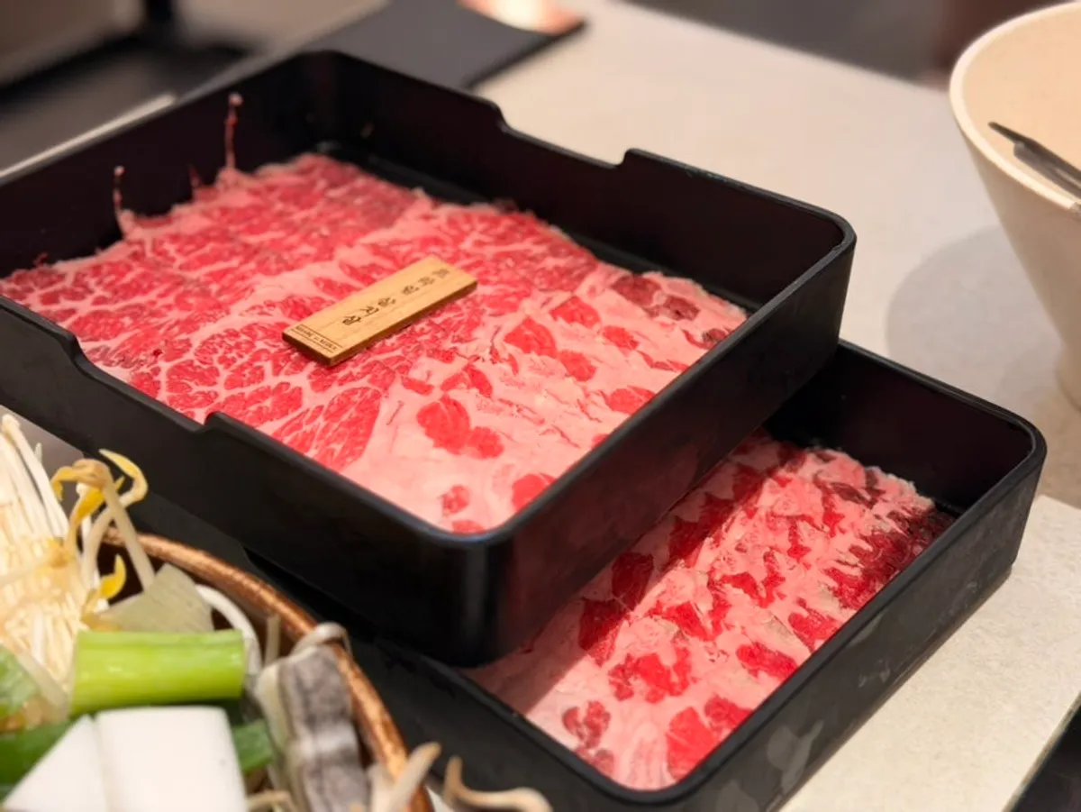 Tray of prime chuck flat shabu meat showing good marbling