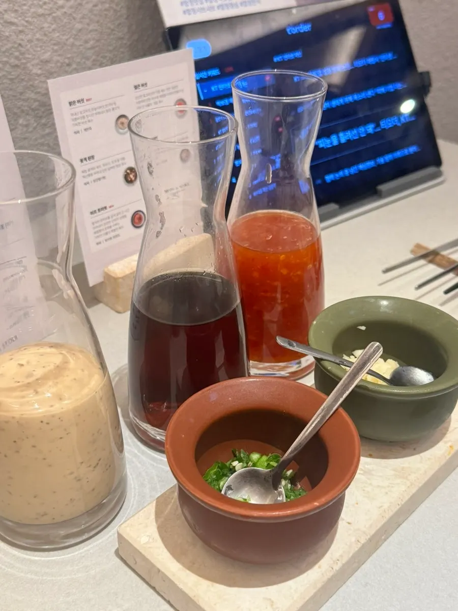 Three shabu-shabu sauces: soy, sesame and chili