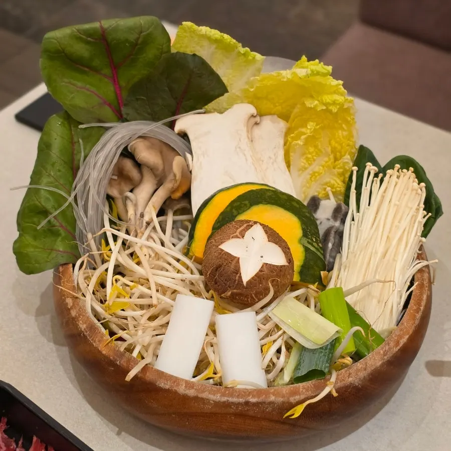 Pot filled with spicy mushroom broth