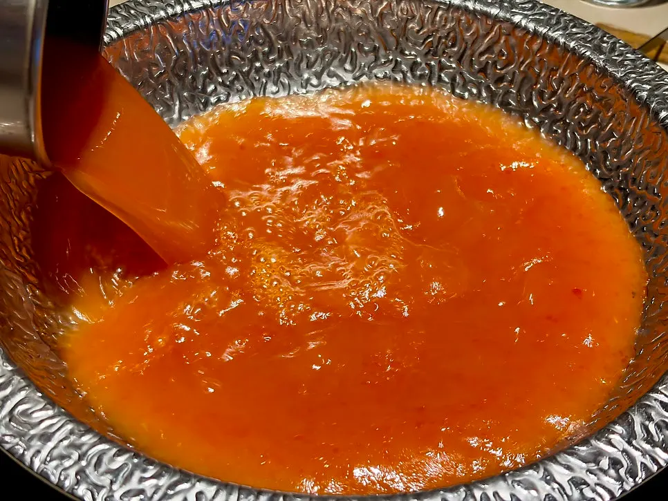 New beef tomato broth in the pot