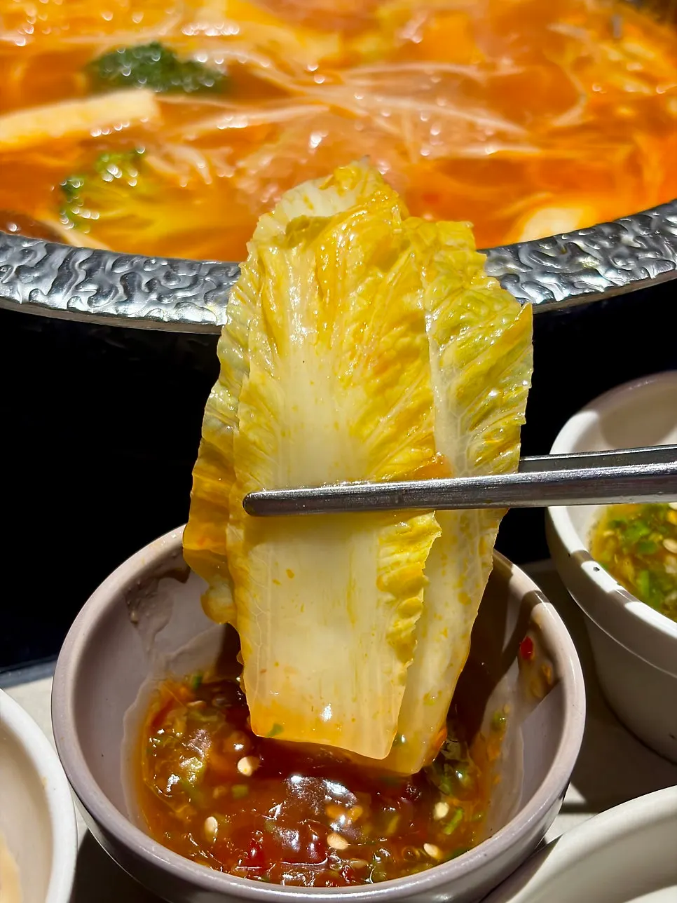 Shabu-shabu vegetables dipped in sauce