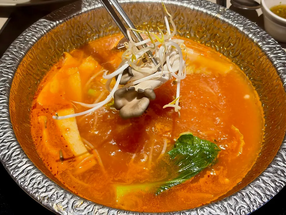A bite of the finished shabu-shabu rice paper wrap