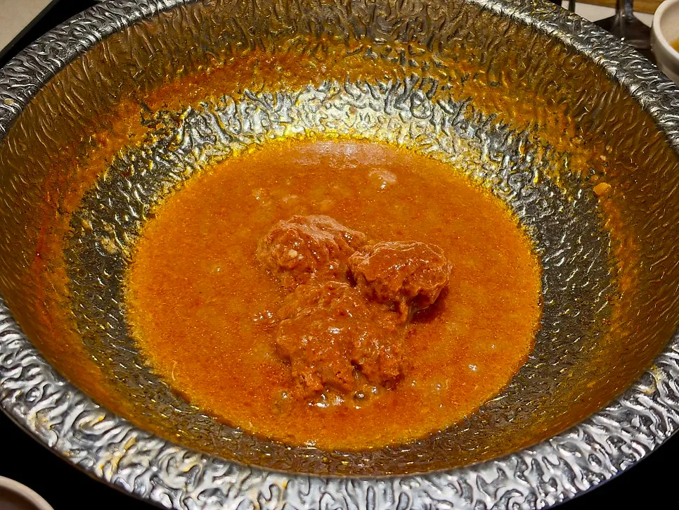 Tomato risotto being made with the leftover beef tomato broth