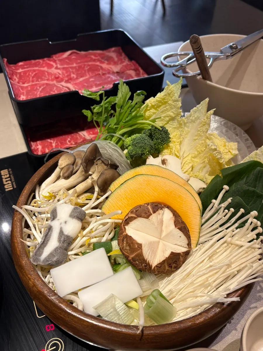 Pot of clear mushroom broth for shabu-shabu
