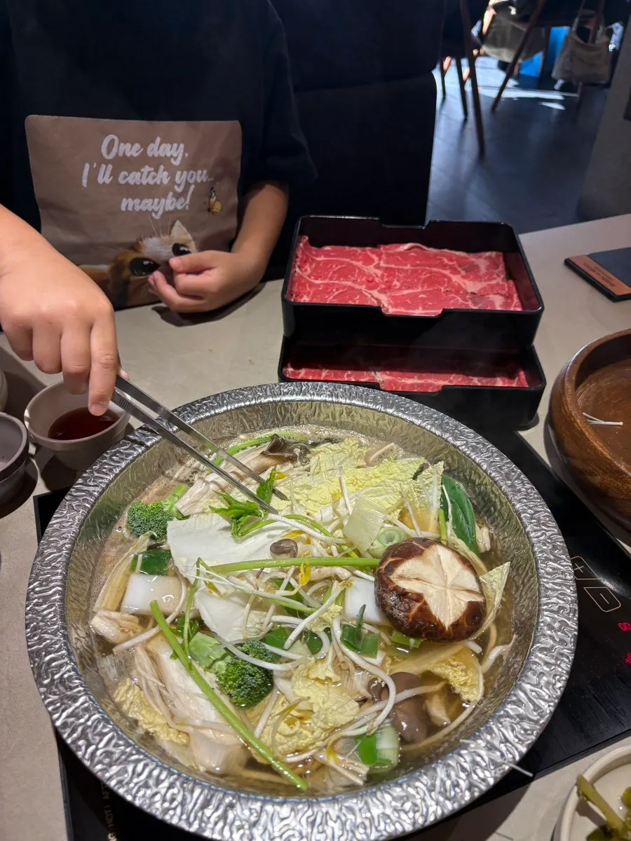 Generous vegetable assortment with boiling shabu-shabu broth