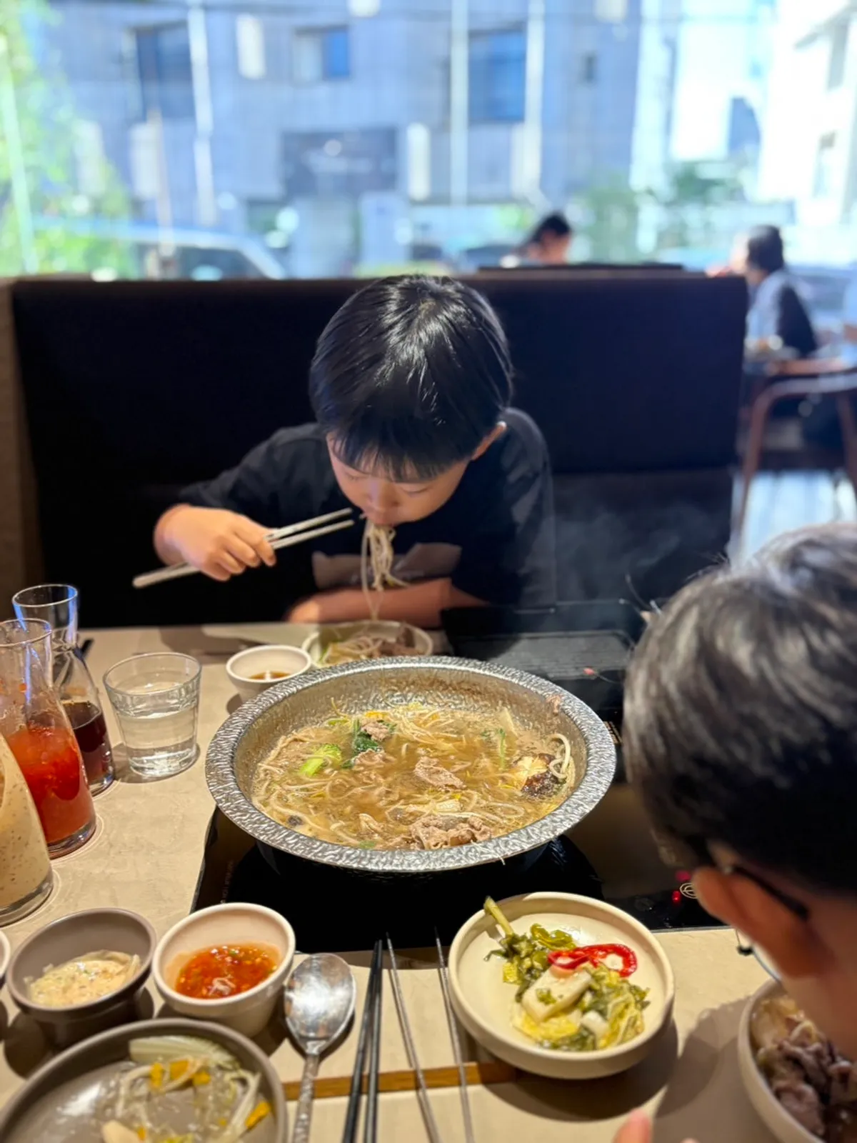 A piece of eye of round shabu-shabu dipped in sauce