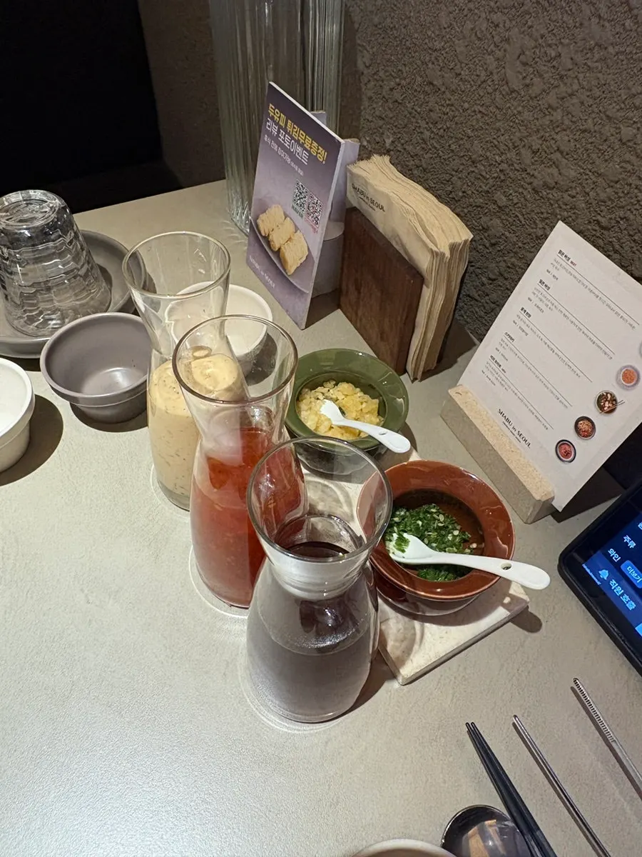 Shabu-shabu sauce, sesame sauce and chili sauce set at the table