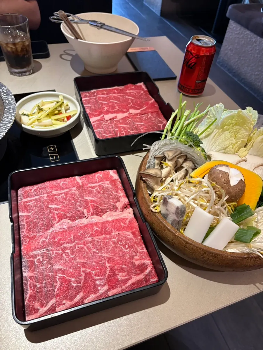 Plate of cooked meat with dipping sauce