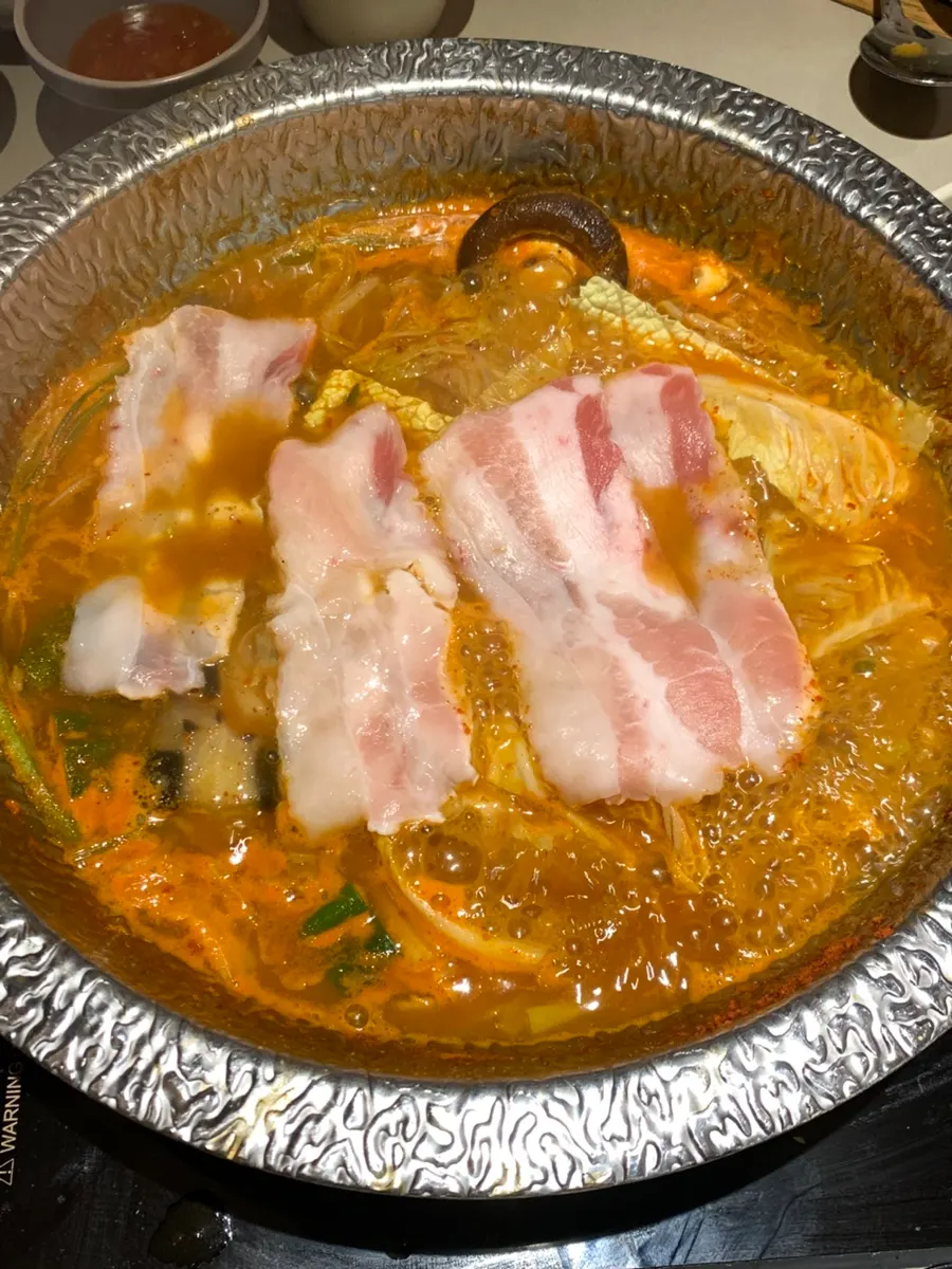A cooked piece of black pork neck