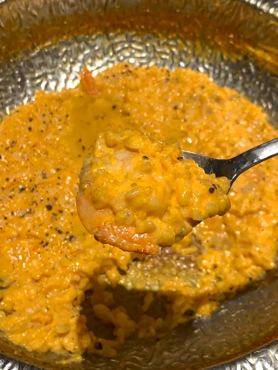 Shrimp rosé risotto being made fresh at the table