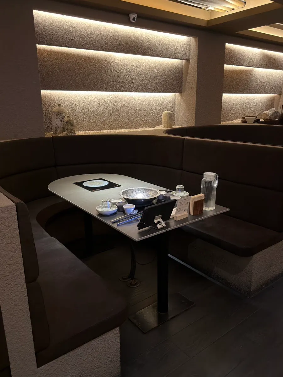 Booth seats separated by partitions at Shabu in Seoul Yongsan Main Branch