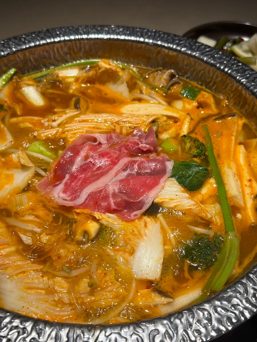 Shabu-shabu table packed with basic ingredients