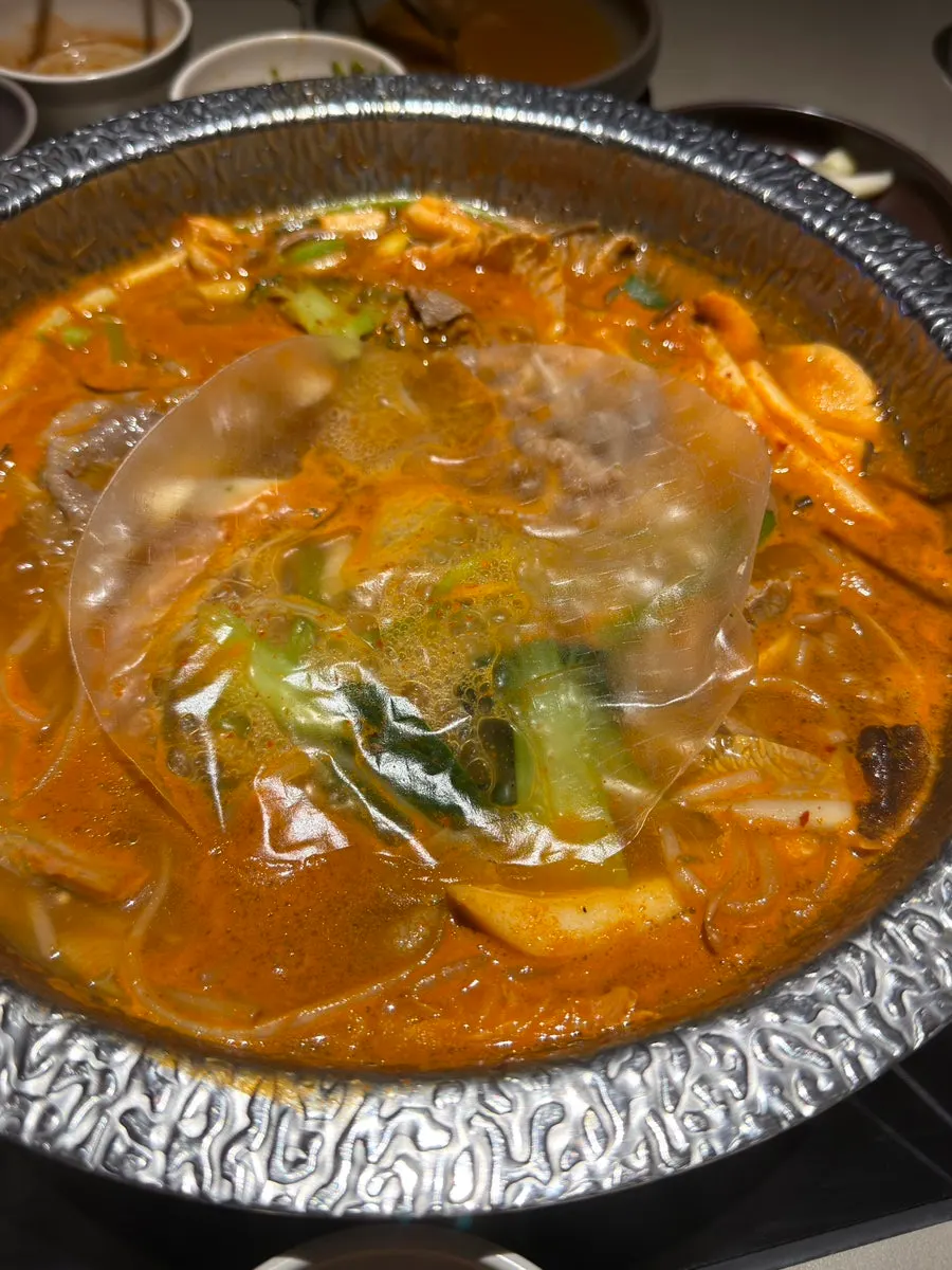 Meat and panda-patterned buncheonja dipped in sauce