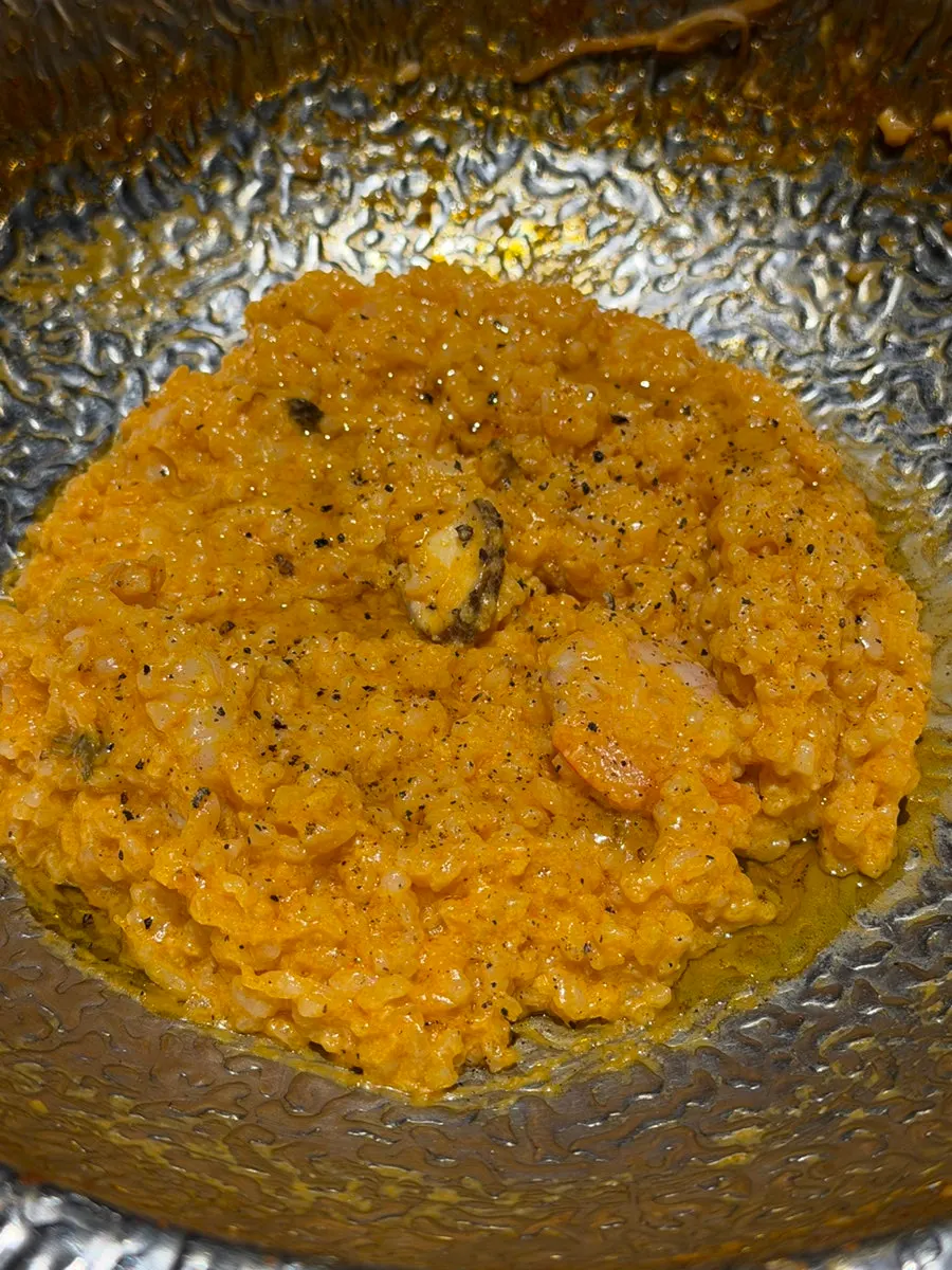 Shrimp rosé risotto finished at the table