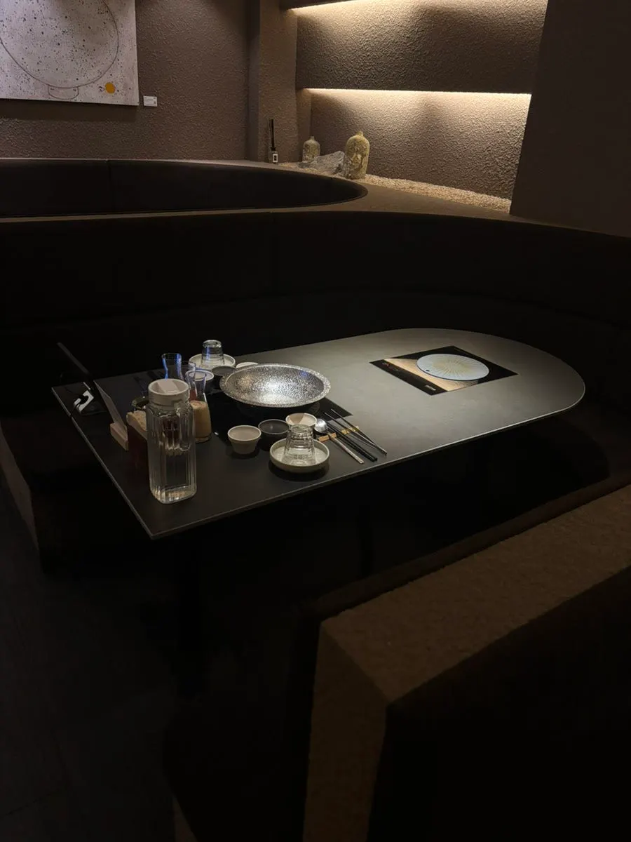 Dim, sleek interior of Shabu in Seoul