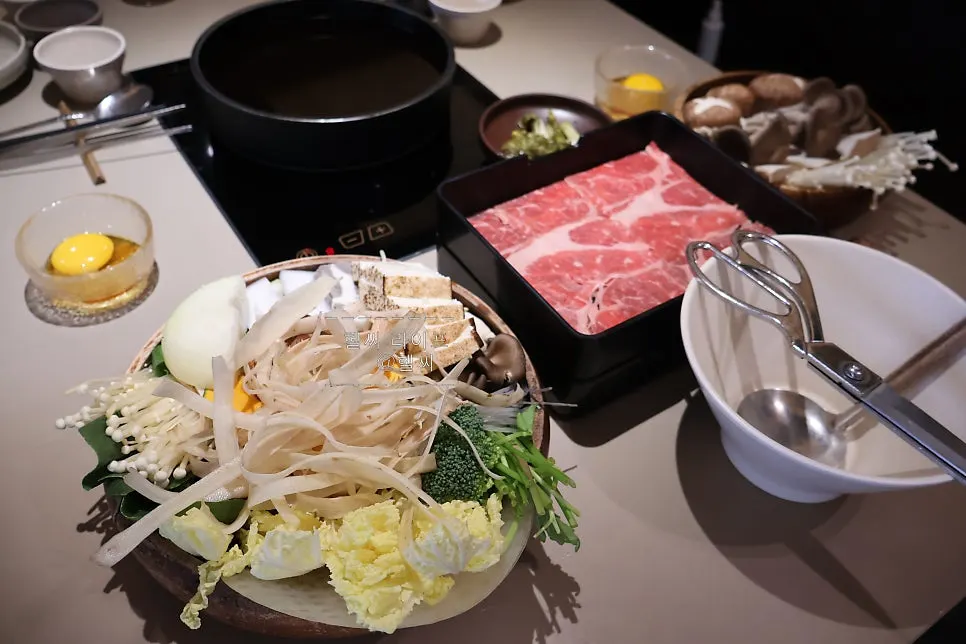 Shabu-shabu spread with eye of round beef and added assorted mushrooms
