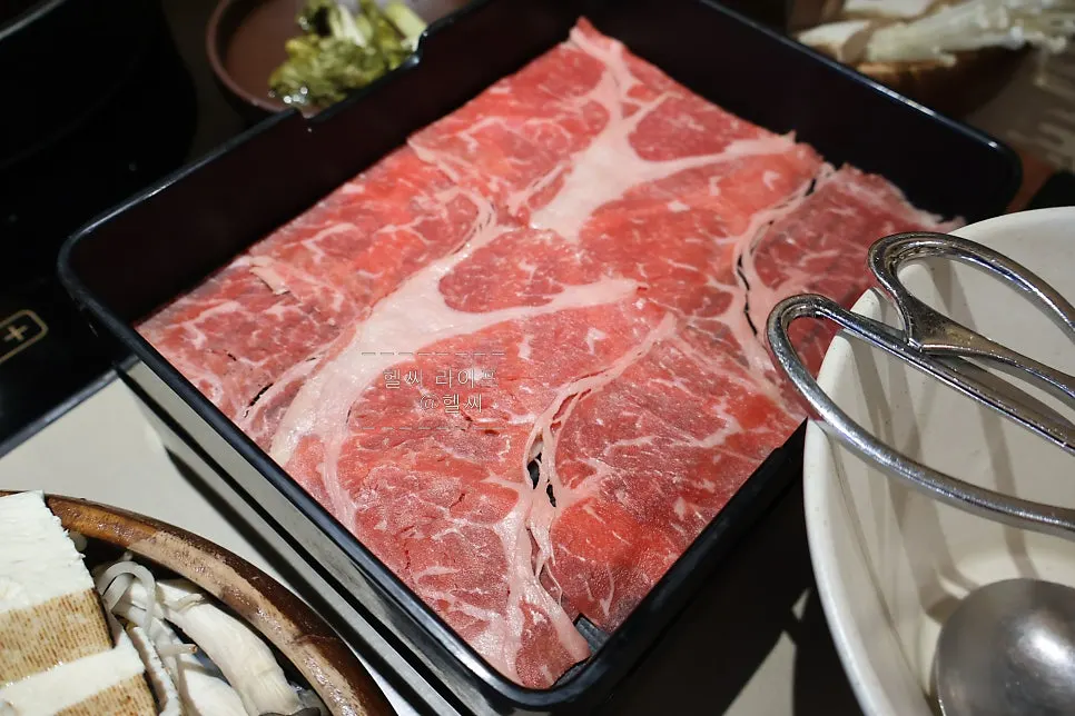 A plate of thin, wide-cut eye of round beef