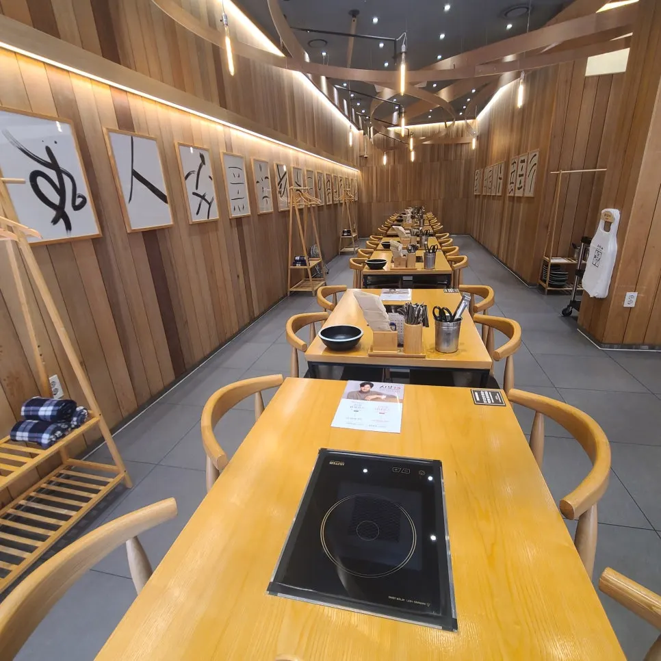 Wood-toned group seating at Shabu20 Daegu Bokhyeon branch