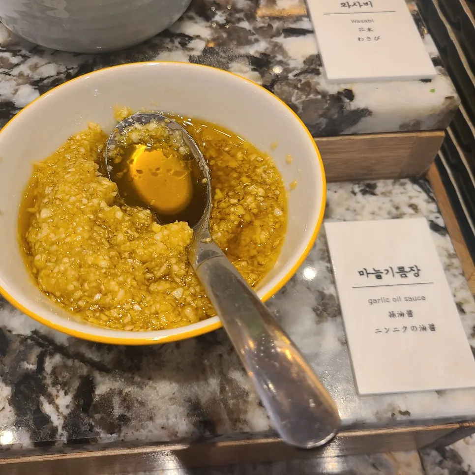 A plate of sauces scooped up by the writer