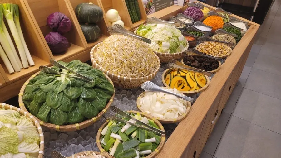 Self-service bar display of rice paper roll ingredients