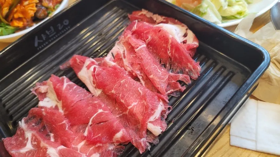 Shabu-shabu meat dipped in soy sauce mix