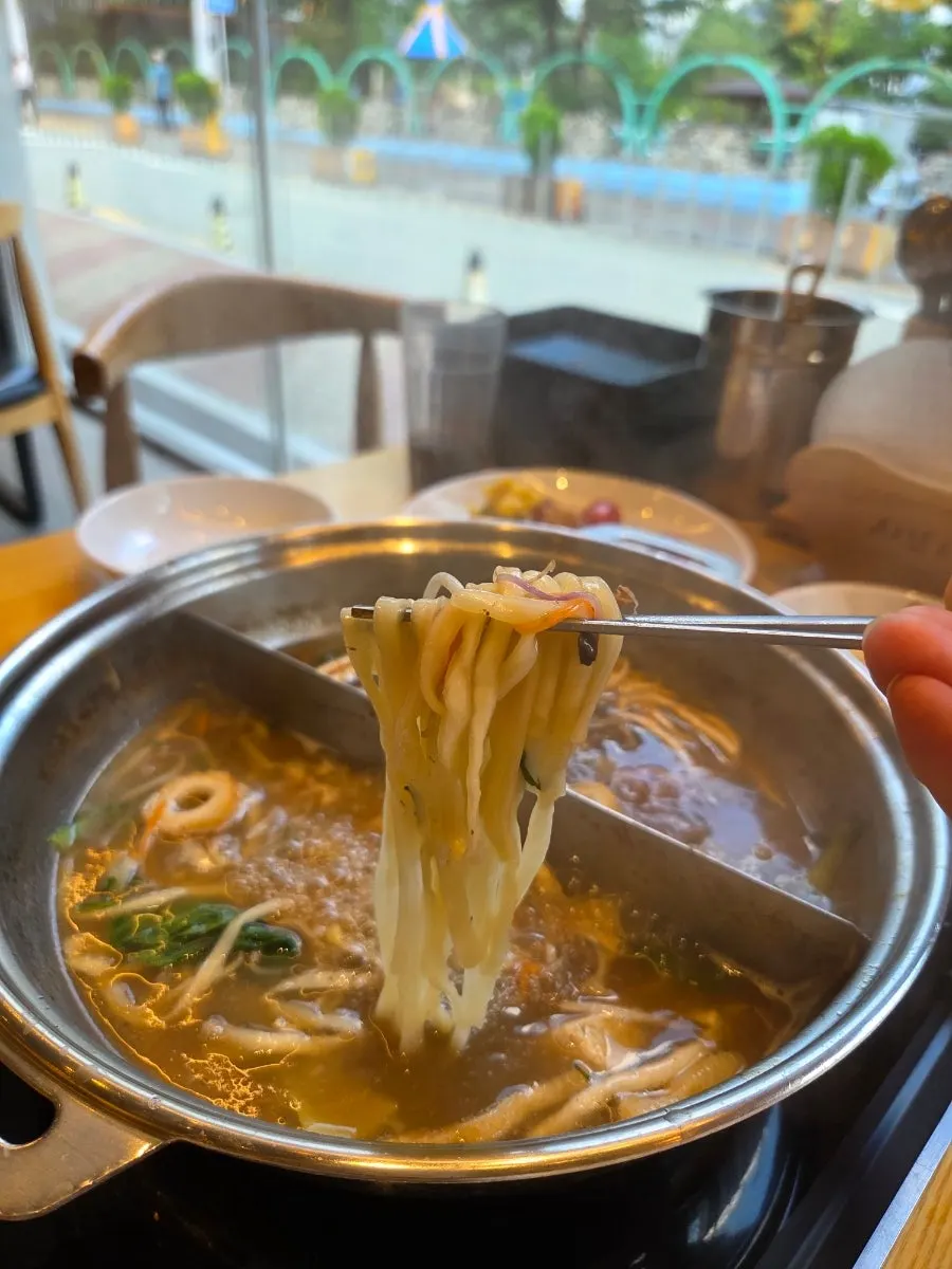 Kalguksu noodles cooked in the shabu-shabu broth