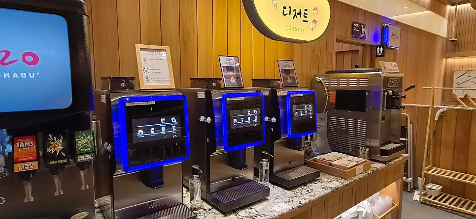 Self-serve drink corner with coffee and juices