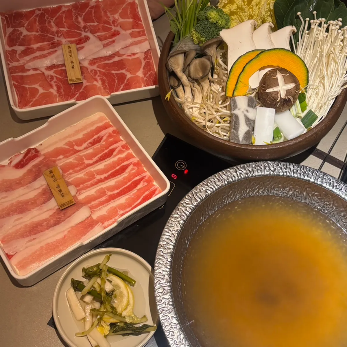 A full spread of black pork belly and neck shabu-shabu set