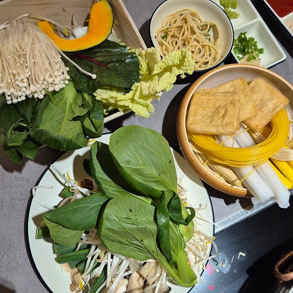 A plate of shabu-shabu ingredients from the self-bar