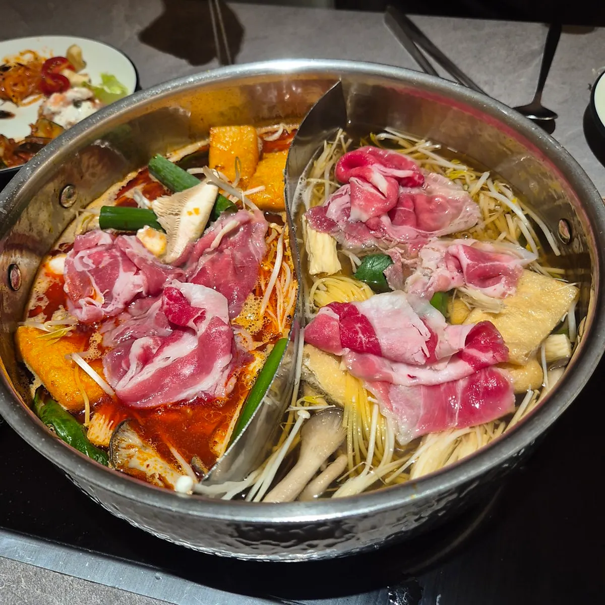 Shrimp jang, galbi, pizza and more laid out on the Shabuway self-bar