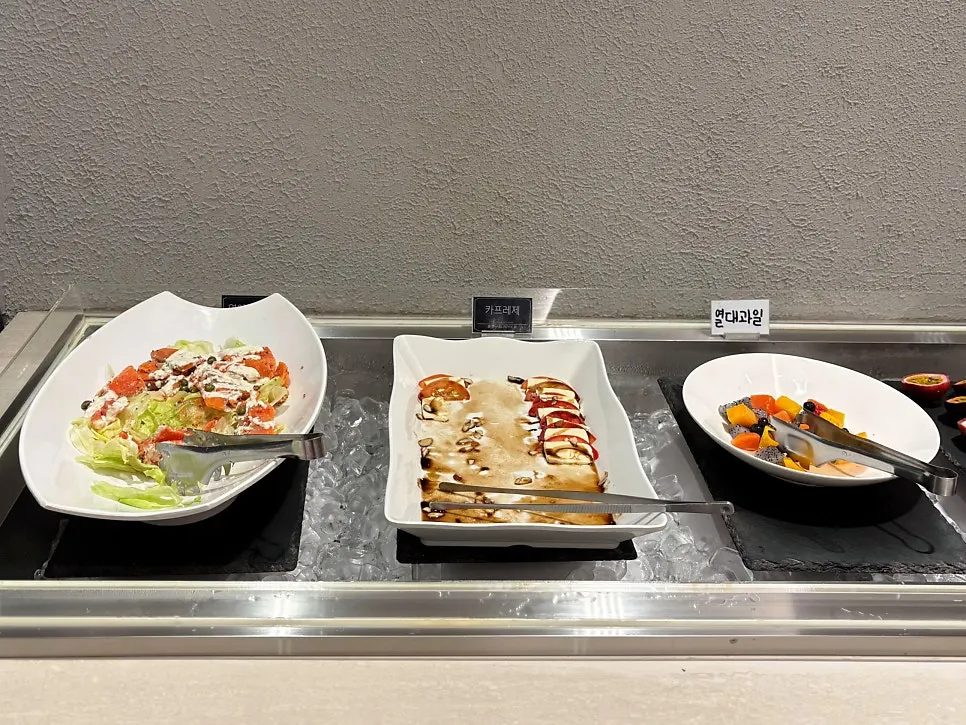 Self-serve bar with rice-wrap vegetables and salads