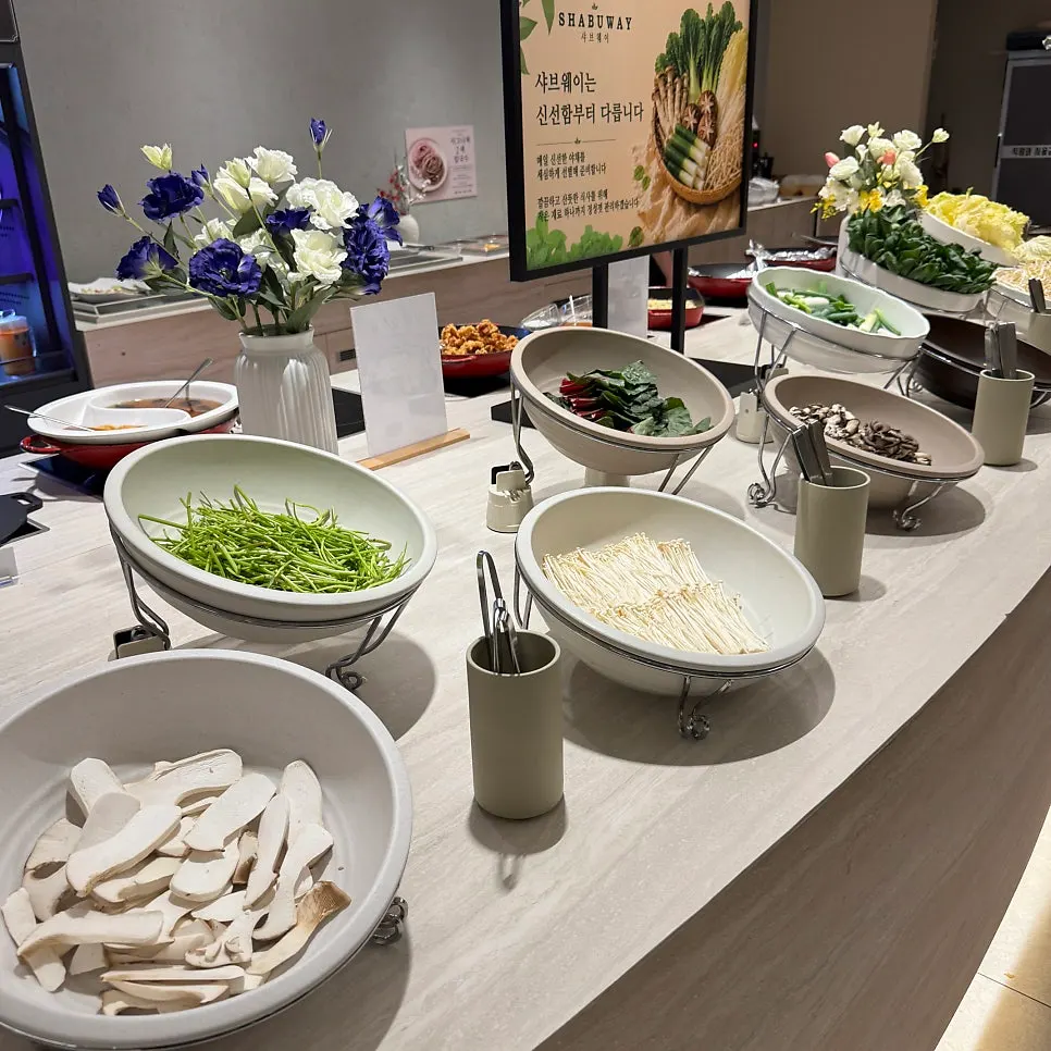 Salad bar with handmade hot food dishes