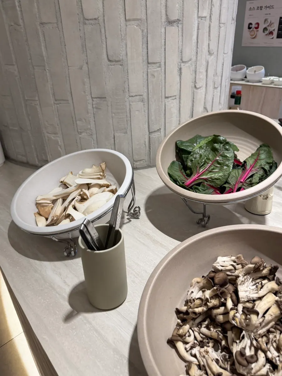Fresh shabu-shabu vegetables displayed at the salad bar
