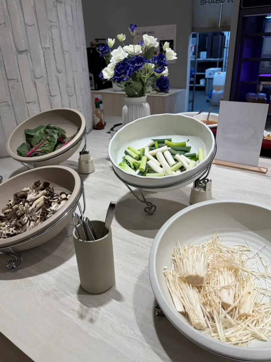 Leafy vegetables laid out at the self-bar vegetable corner