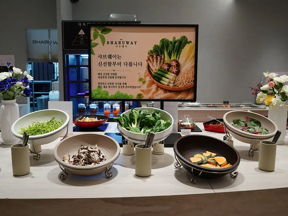 Salad bar packed with vegetables and sides