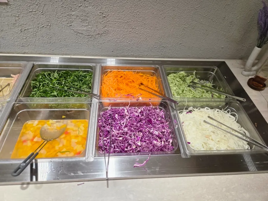 Plate of side dishes brought from the salad bar