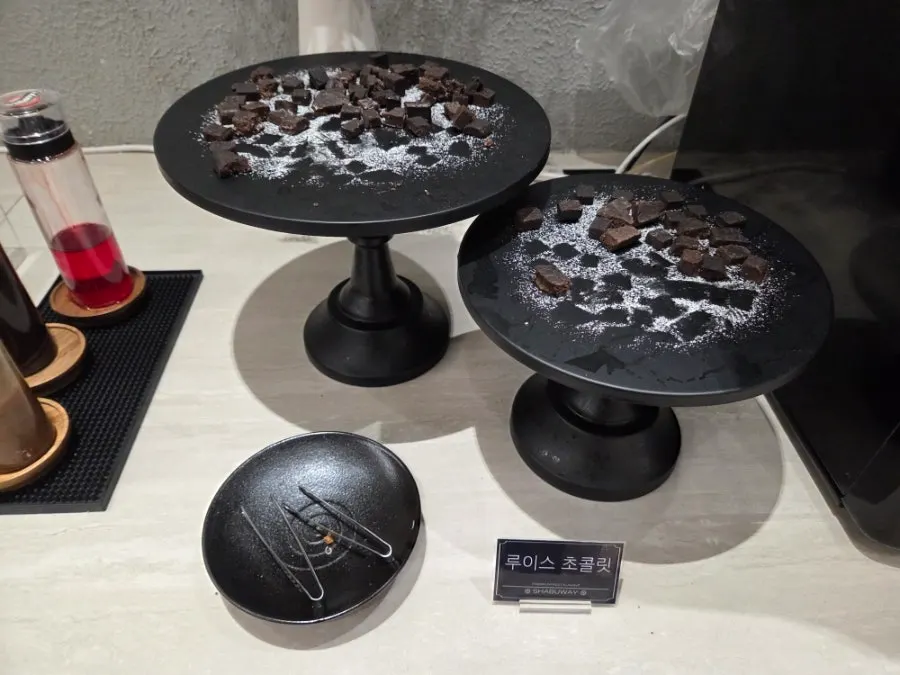 Black sapphire grapes and chocolate served for dessert