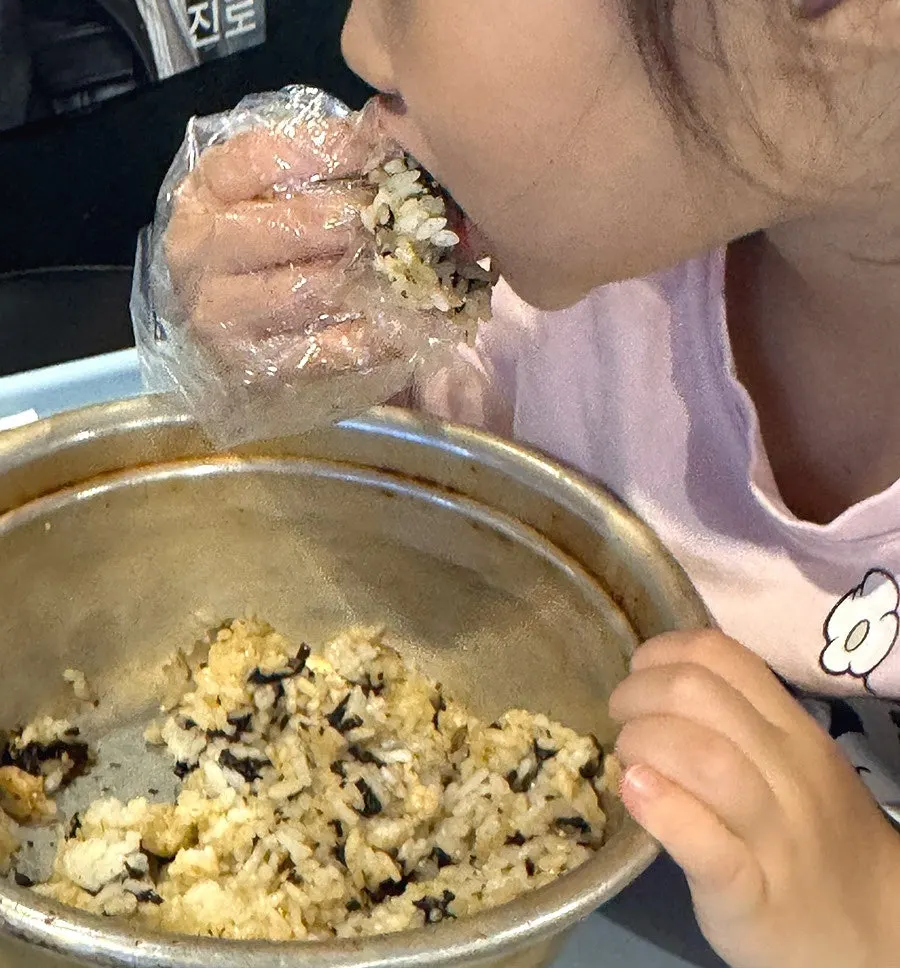 Charcoal rice ball being mixed