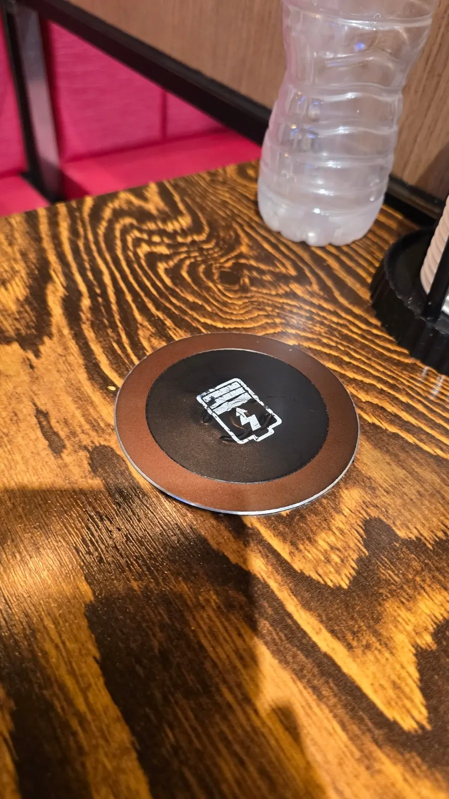 Wireless charging pad on table and tablet ordering screen